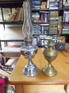 2 x oil lamps , one chrome , one brass